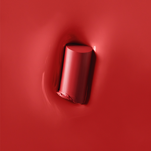 Texture rub of Mary Kay Supreme Hydrating Lipstick in shade Rockstar Red